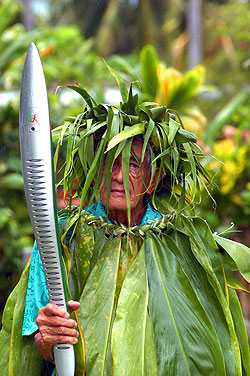 Sir Apenera Short. The Queens Baton arrives in the Cook Islands, the 68th and third last country to host the baton before it arrives in Australia. Sir Apenera Short, a former Queen's representative is dressed in Teetree leaves, known as 'rauti'.
