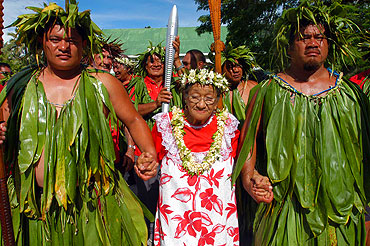 Aitutaki. As the relay continues throughout the Cook Islands, the baton is welcomed to the southern island of Aitutaki, where this baby is mesmerized by its glowing lights and unique shape.